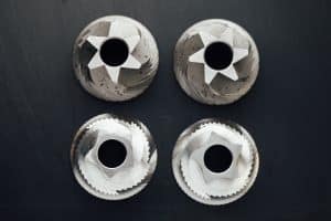 burrs from a disassembled coffee bean grinder
